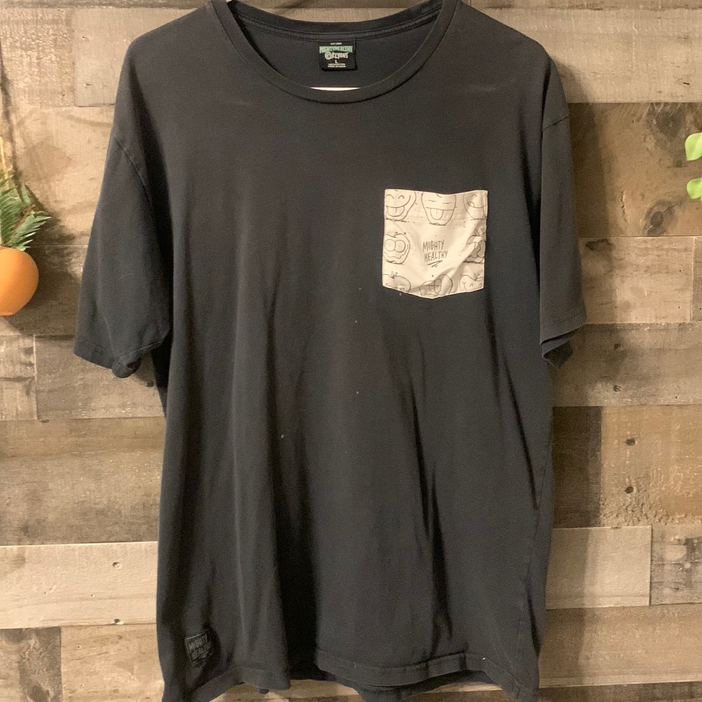 Short sleeve t shirt has a few small bleach marks that are pictured